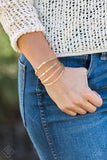 Get Used To GRIT - Gold Cuff Bracelet Paparazzi